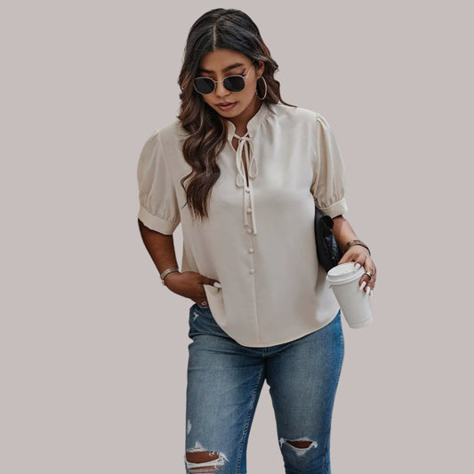 Blusa Nelly con cuello cruzado y mangas abullonadas